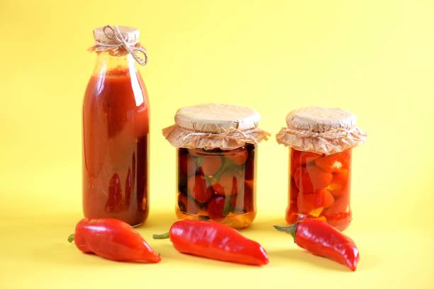 Pickled red pepper snacks - pizza sauce, cherry pepper with soft cheese and hot cherry pepper. stock photo