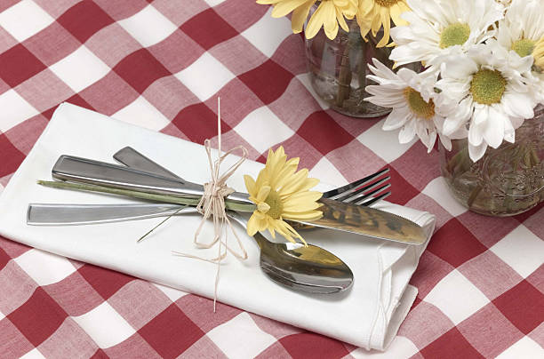 picnic silverware and flowers stock photo
