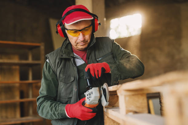 carpenter working with an electric grinder 2931445 Stock Photo at Vecteezy