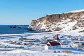 istock Picturesque aerial view of Vik I Myrdal church at the top of the hill in Iceland in winter. 1216432082