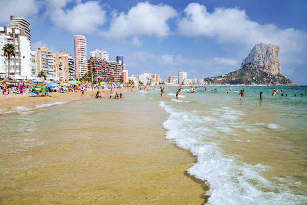 Picturesque landscape of sandy beach in Calpe, Spain Picturesque landscape of sandy beach in Calpe, Spain calpe stock pictures, royalty-free photos & images