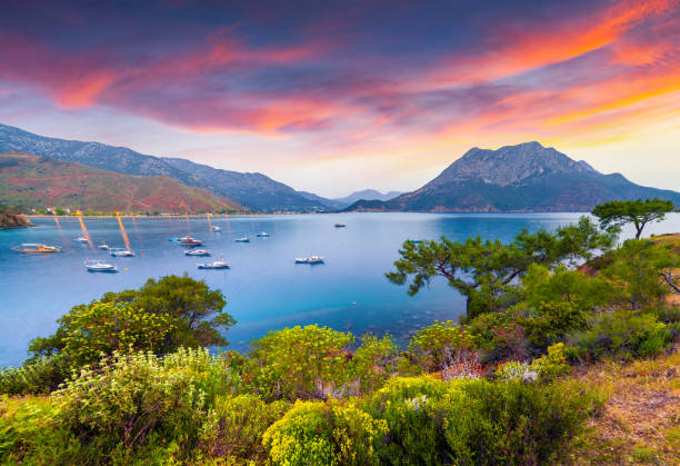 Picturesque Mediterranean seascape in Turkey. Picturesque Mediterranean seascape in Turkey. Colorful spring sunrise in Adrasan bay with view of Moses Mountain. District of Kemer, Antalya Province. Artistic style post processed photo. türkiye country stock pictures, royalty-free photos & images