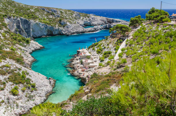 Picturesque Porto Limnionas rocky beach. It is situated on west coast of Zakynthos island, Greece. stock photo