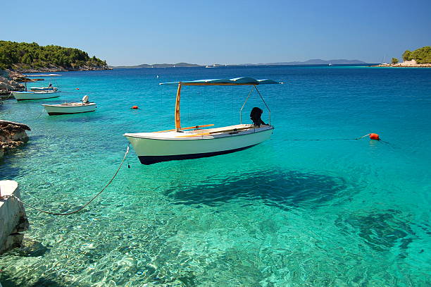 Picturesque scene of boats on Adriatic bay -Brac island, Croatia stock photo