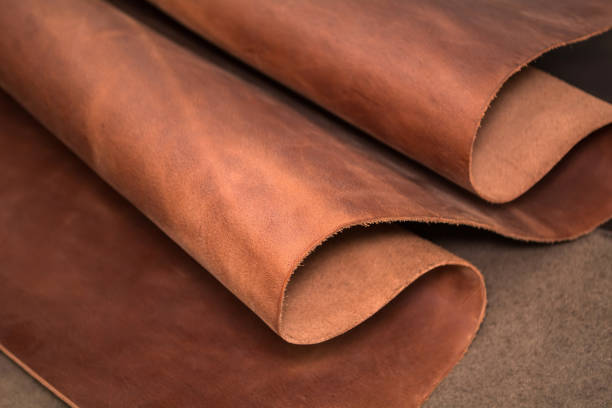 A piece of brown leather. Texture of natural material stock photo