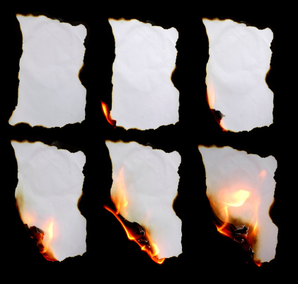 burning paper in dark background