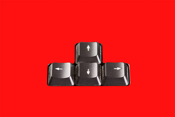 Pieces of a keyboards with arrow pointing in differents directio stock photo
