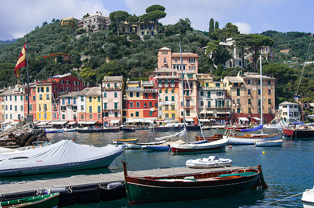 Pier of Portofino village with boats and house stock photo