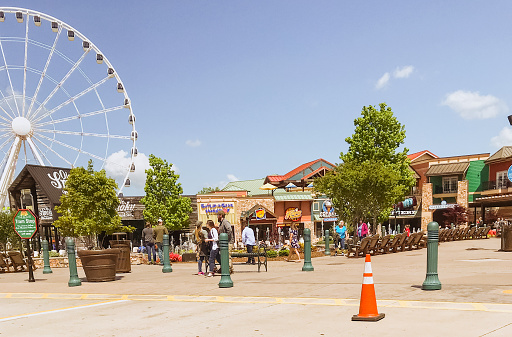 April 27, 2018.  Pigeon Forge, Tennessee. Located in the Appalachian Mountains, Pigeon Forge is a tourist destination for many. Full of shops, a ferris wheel, good food, and various shops, this is a great place for the whole family. Pigeon Forge originally was created as a 19th-century iron forge along the Little Pigeon River.