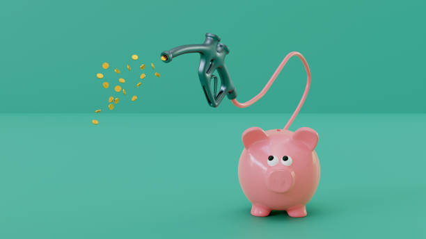 Piggy bank looks worried as money for gas disappear from its tale stock photo