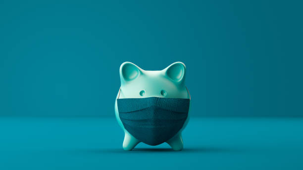 Piggy Bank Wearing A Surgical Mask over blue background.