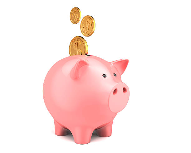 Piggy bank, with coins falling into slot stock photo