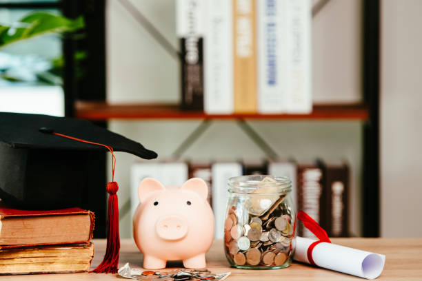 piggy bank With Graduation Cap on old wood,Money saving concept. stock photo