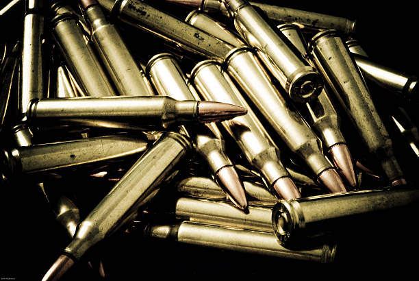 Pile of 5.56/.223 rifle Ammunition Pile of ammunition for a M16/AR15 pattern rifle. nra stock pictures, royalty-free photos & images