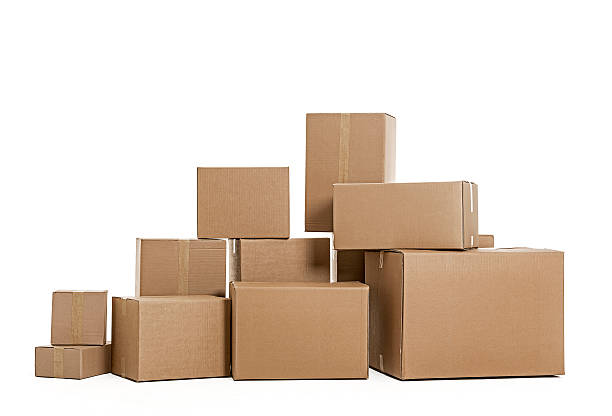 Pile of cardboard boxes on white background Pile of cardboard boxes stacked one on another on white background. Studio shot, isolated white background.  medium group of objects stock pictures, royalty-free photos & images