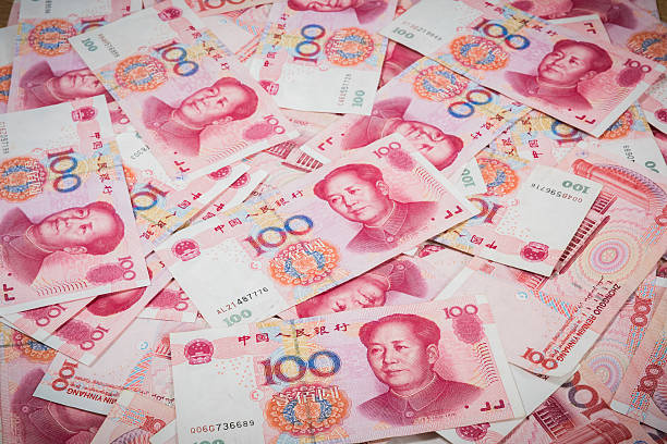 Pile of Chinese currency 100s of yuan  closeup 100 Yuan, Chinese money is background chinese currency stock pictures, royalty-free photos & images