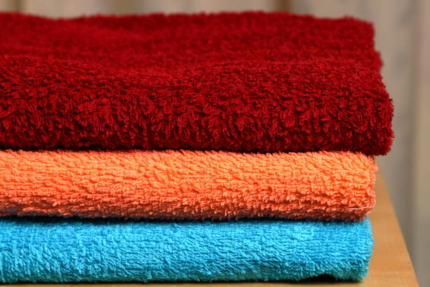 Pile of colored towels. stock photo