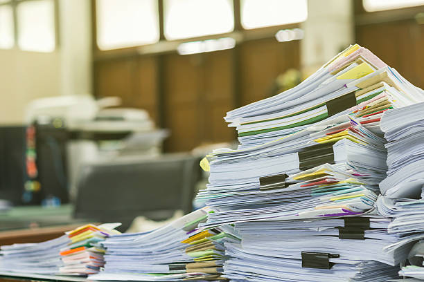 Pile of documents on desk at workplace  bureaucracy stock pictures, royalty-free photos & images