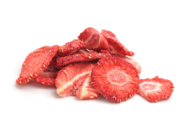 Pile of dried strawberries stock photo
