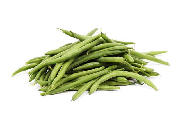 Pile of fresh green beans over a white background stock photo