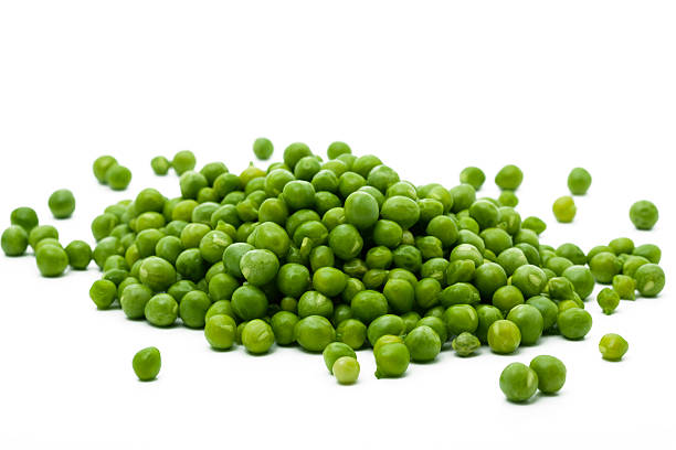 pile of green peas stock photo