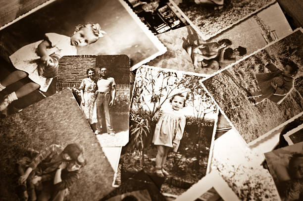 A pile of old black and white photographs Vintage Family Black and White Photos selective focus photos stock pictures, royalty-free photos & images