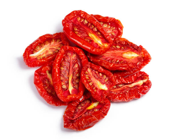 Pile of sundried tomato halves, paths, top view Pile of sundried or dried tomato halves, top view. Clipping paths, shadow separated dried food photos stock pictures, royalty-free photos & images