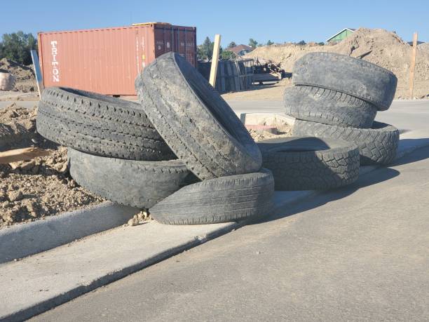Pile of used tires at a large construction site. stock photo