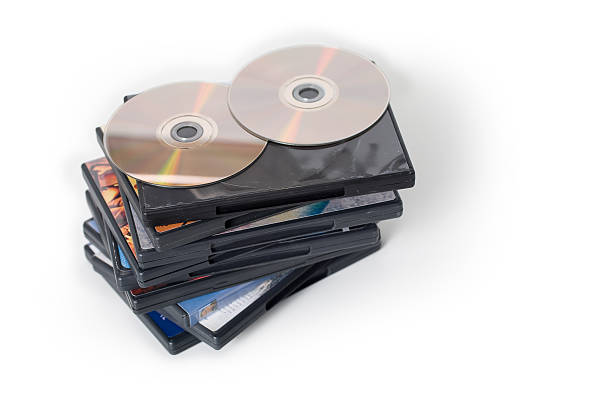 DVD Pile A pile of DVD cases with DVDs on top dvd stock pictures, royalty-free photos & images
