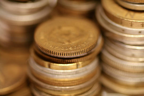 Piles of coins stock photo