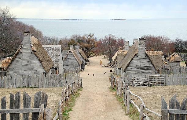 Pilgrims Settlement "Plimoth Plantation is a living museum in Plymouth, Massachusetts that shows the original settlement of the Plymouth Colony established in the 17th century by English colonists, some of whom later became known as Pilgrims." pilgrim stock pictures, royalty-free photos & images