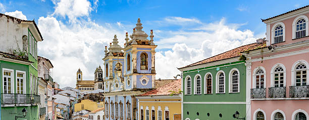Pillory Facades of the old houses and townhouses and towers of historic churches in Pelourinho neighborhood in Salvador, Bahia pelourinho stock pictures, royalty-free photos & images