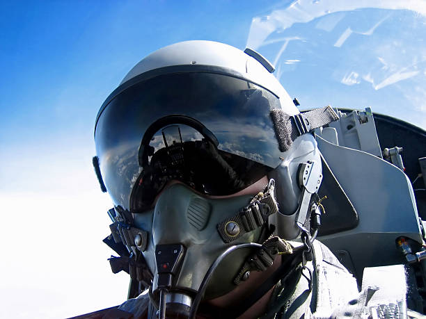 Pilot's Face A fighter Pilot's self portrait ..ahem, thats me. Zoom into the visor, and see the cockpit and the hand taking the shot. fighter plane stock pictures, royalty-free photos & images