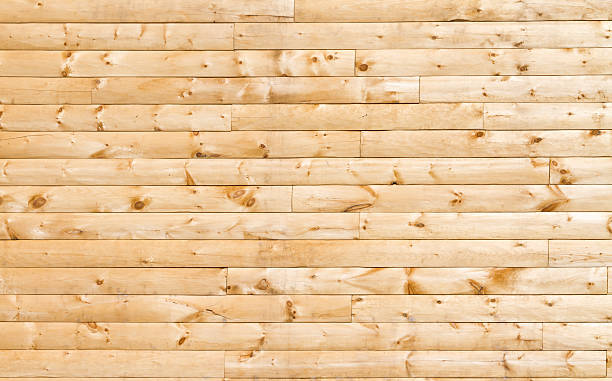 Pine Siding Photo of pine siding on a new home. knotted wood stock pictures, royalty-free photos & images