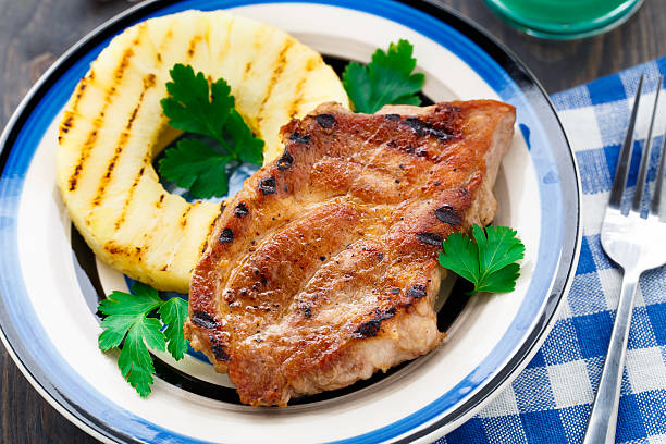 Pineapple grilled pork chop stock photo
