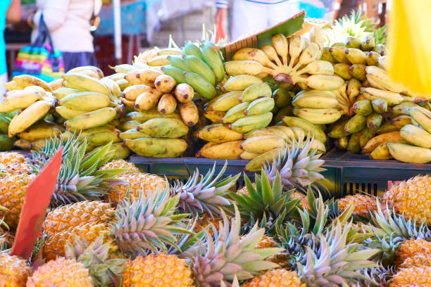 Pineapples and bananas in the market - Reunion Island stock photo