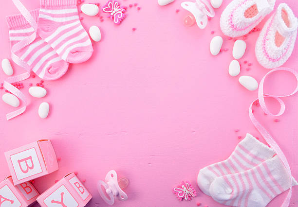Pink Baby Shower Nursery Background Its a Girl pink theme Baby Shower or Nursery background with decorated borders on pink wood background. it's a girl stock pictures, royalty-free photos & images