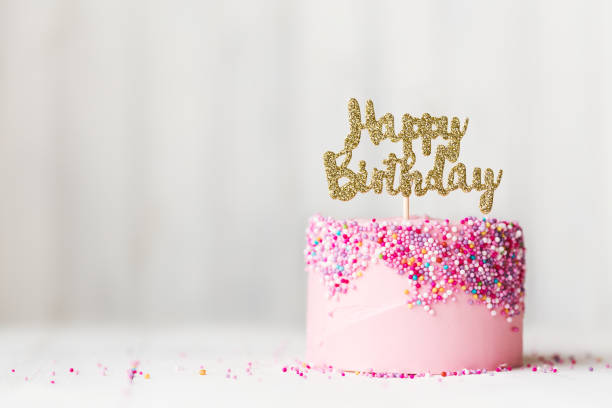 Pink birthday cake Birthday cake with sparkly banner happy birthday words stock pictures, royalty-free photos & images