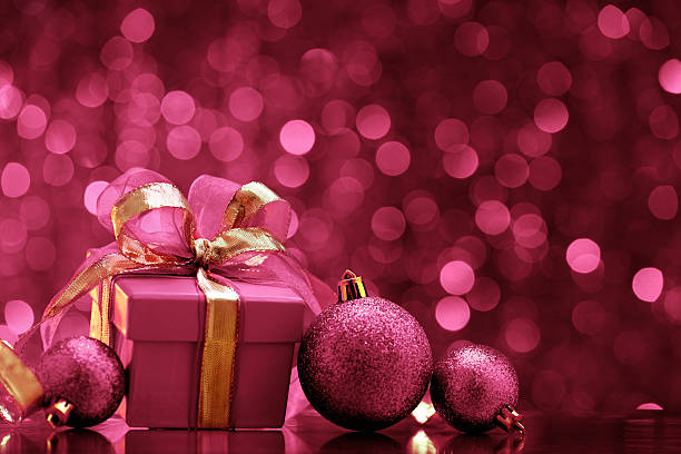 Pink christmas balls and gift boxes stock photo