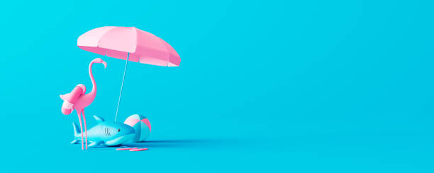 Pink flamingo and rubber shark with beach accessories on blue background. Summer vacation concept 3D Render stock photo