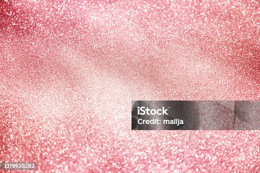 istock pink glittering sparkling background 1319930282
