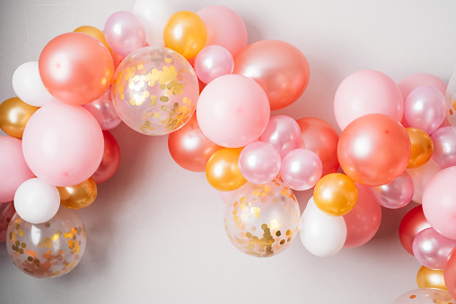 Pink golden balloon garland
Festive decoration hanging on the wall
