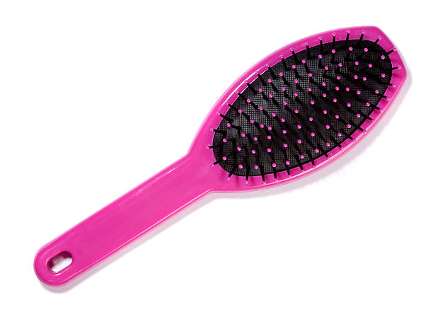Pink hairbrush on white stock photo