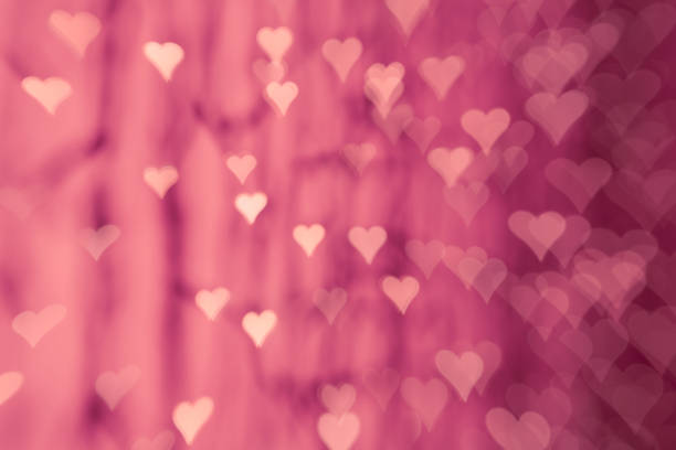 Pink hearts - Defocused lights abstract bokeh background love Valentine's Day celebration party stock photo