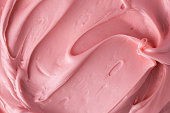 istock Pink icing frosting close up texture 1342473926