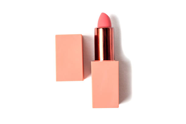 Pink lipstick isolated on a white background, top view stock photo