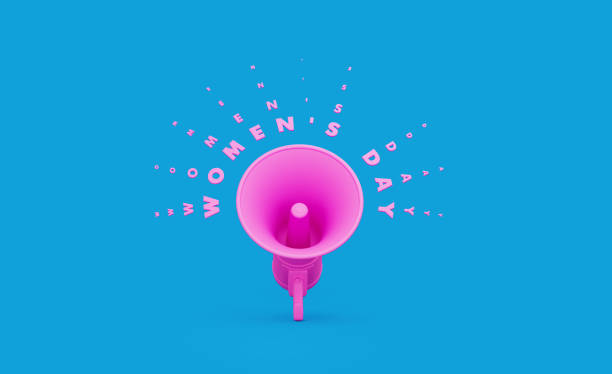 Pink megaphone with International Women's Day text over blue background.  Horizontal composition with copy space. Great use for announcement concept.