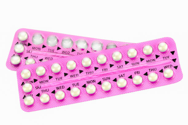 Pink oral contraceptive pill strips. stock photo