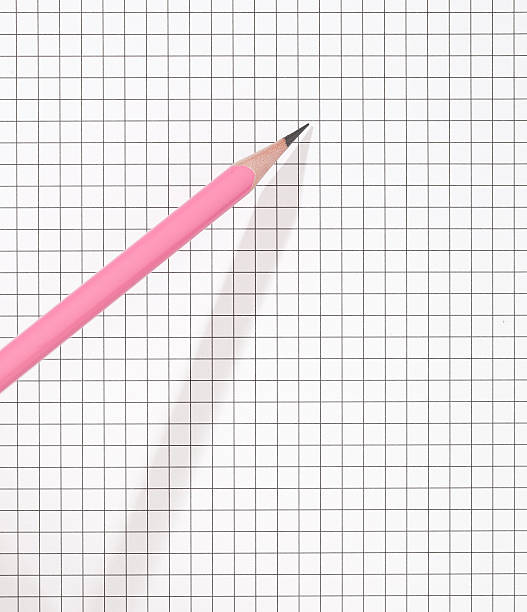 Pink pencil graph paper stock photo