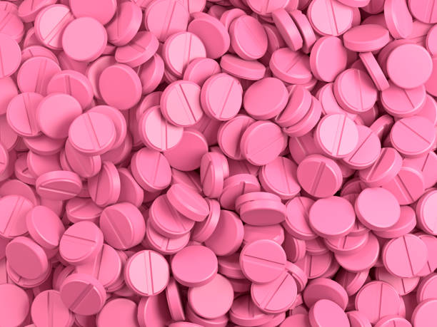 Pink pills background Group of pills. 3d illustration. amphetamine stock pictures, royalty-free photos & images